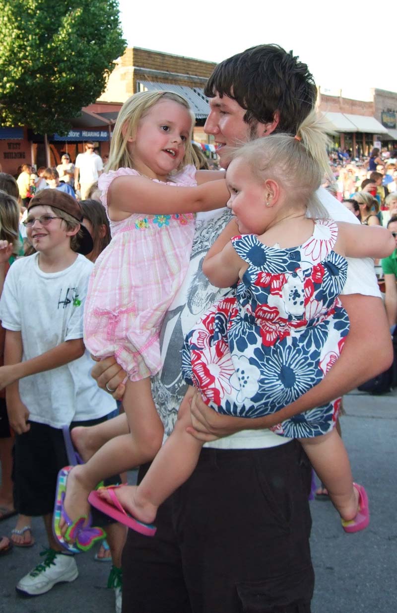 photo of crowd listening to band perform